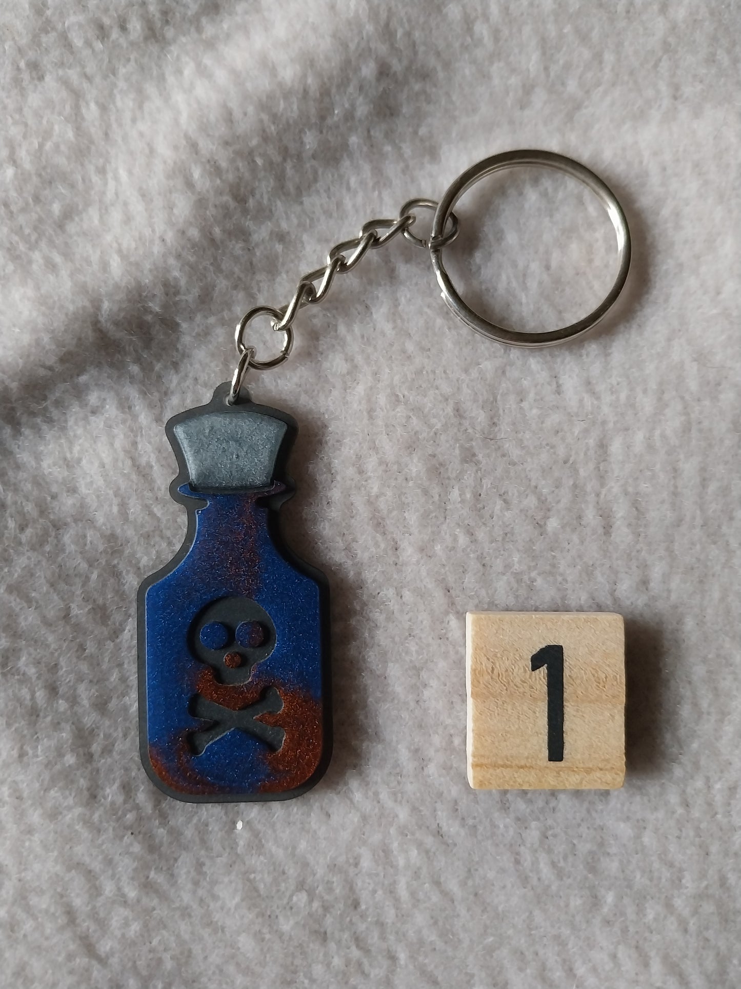 Porte-clefs fiole de poison