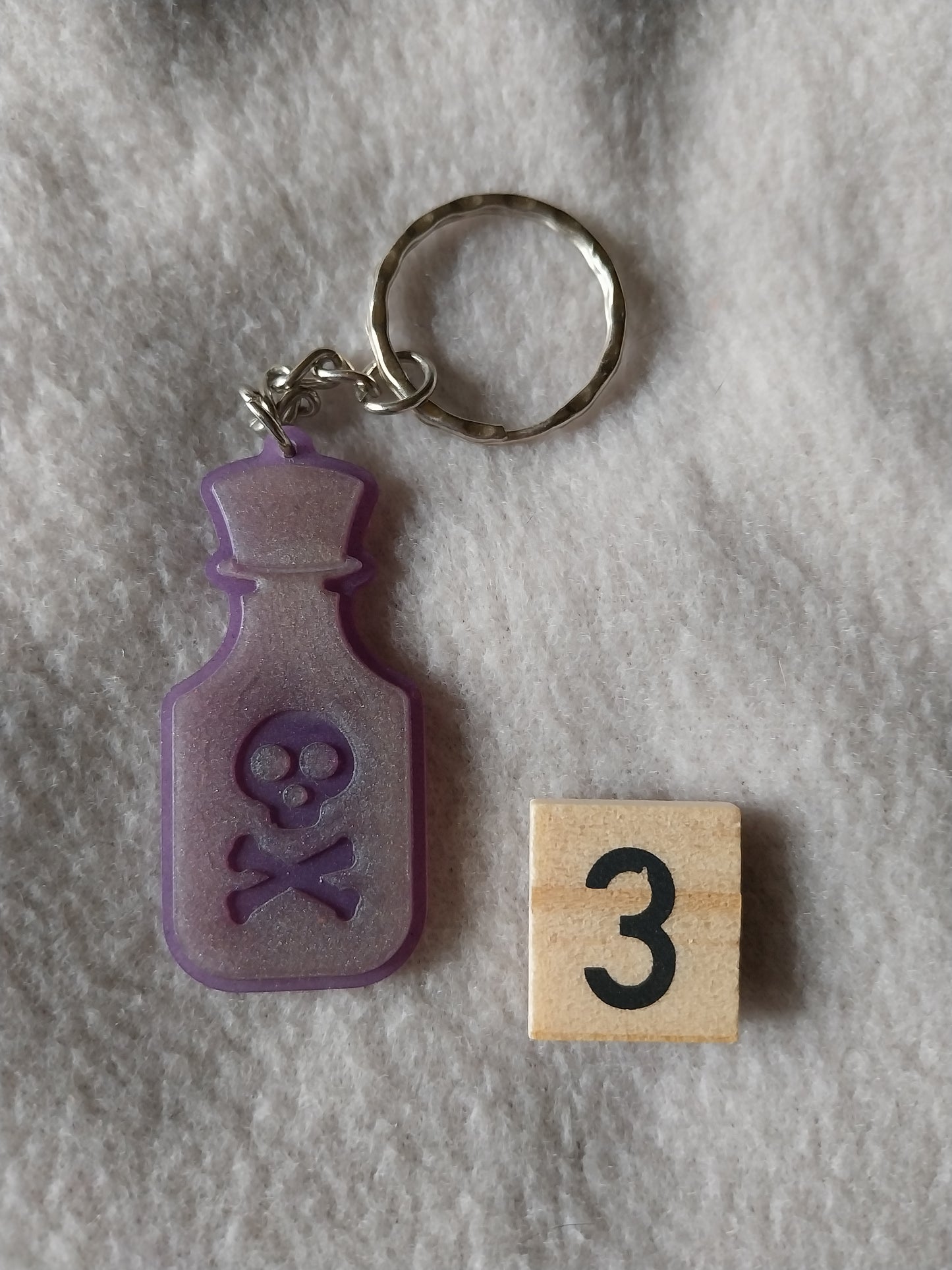Porte-clefs fiole de poison