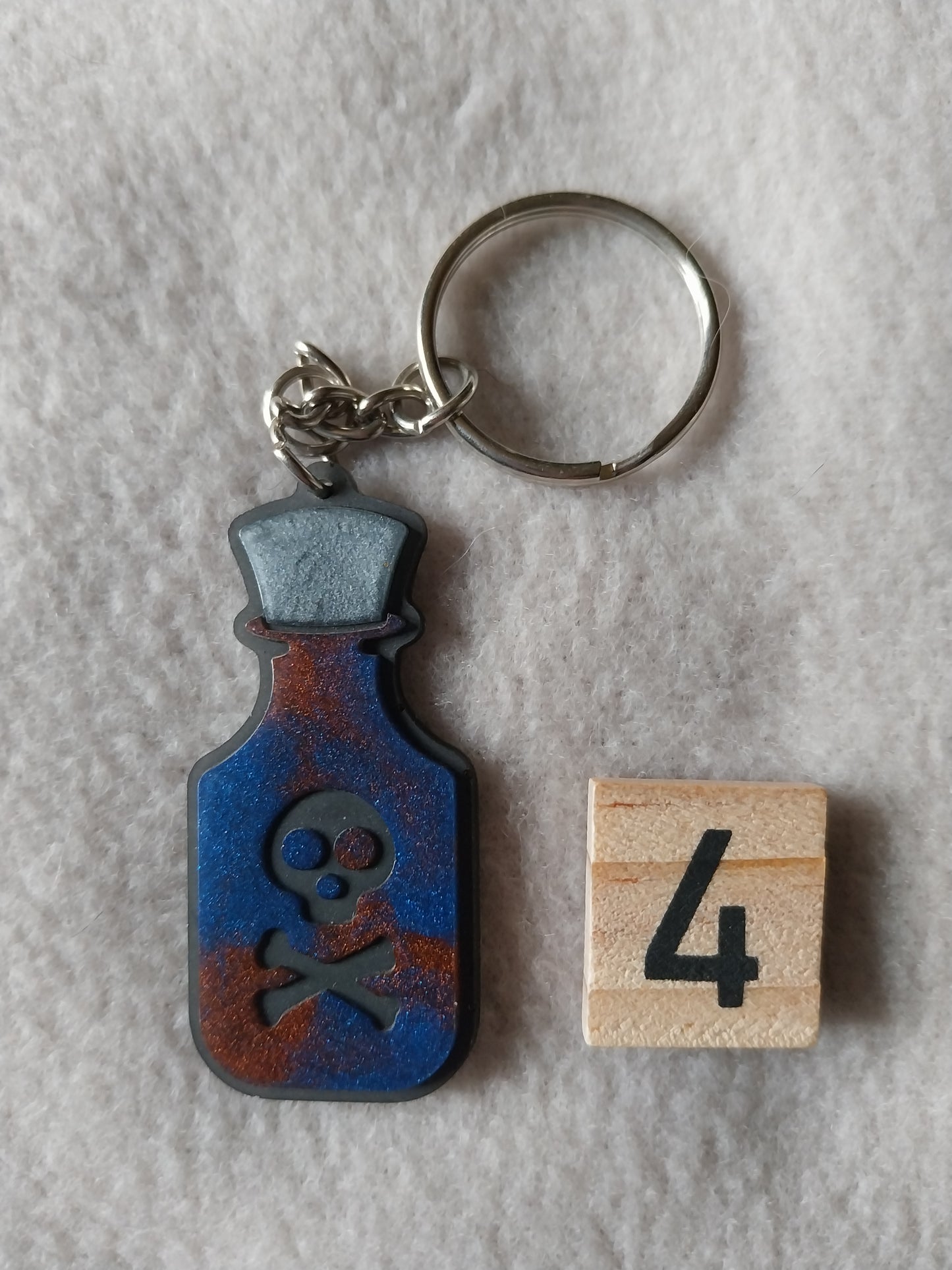 Porte-clefs fiole de poison